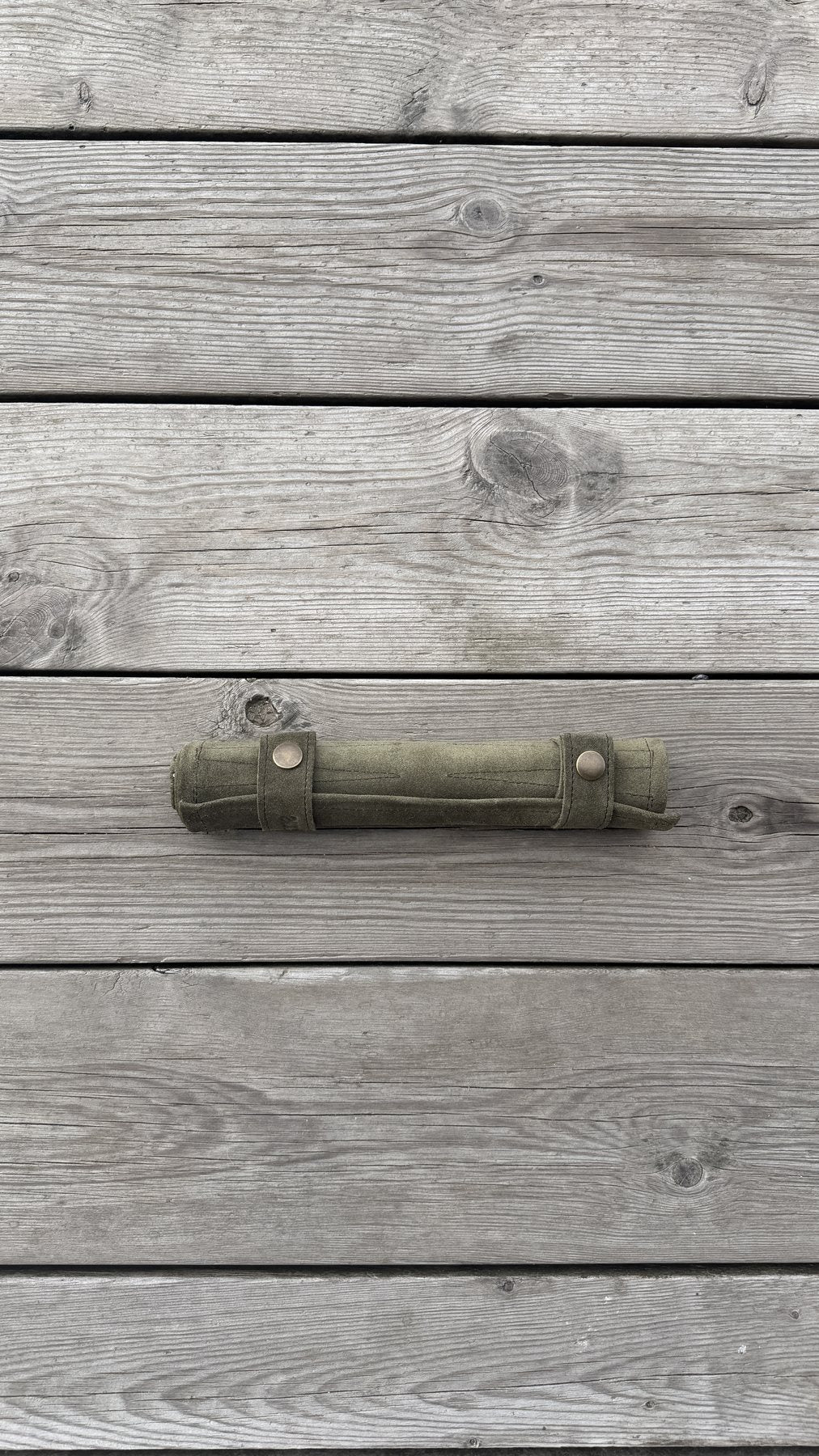Close-up of Olive Green suede backgammon playing surface