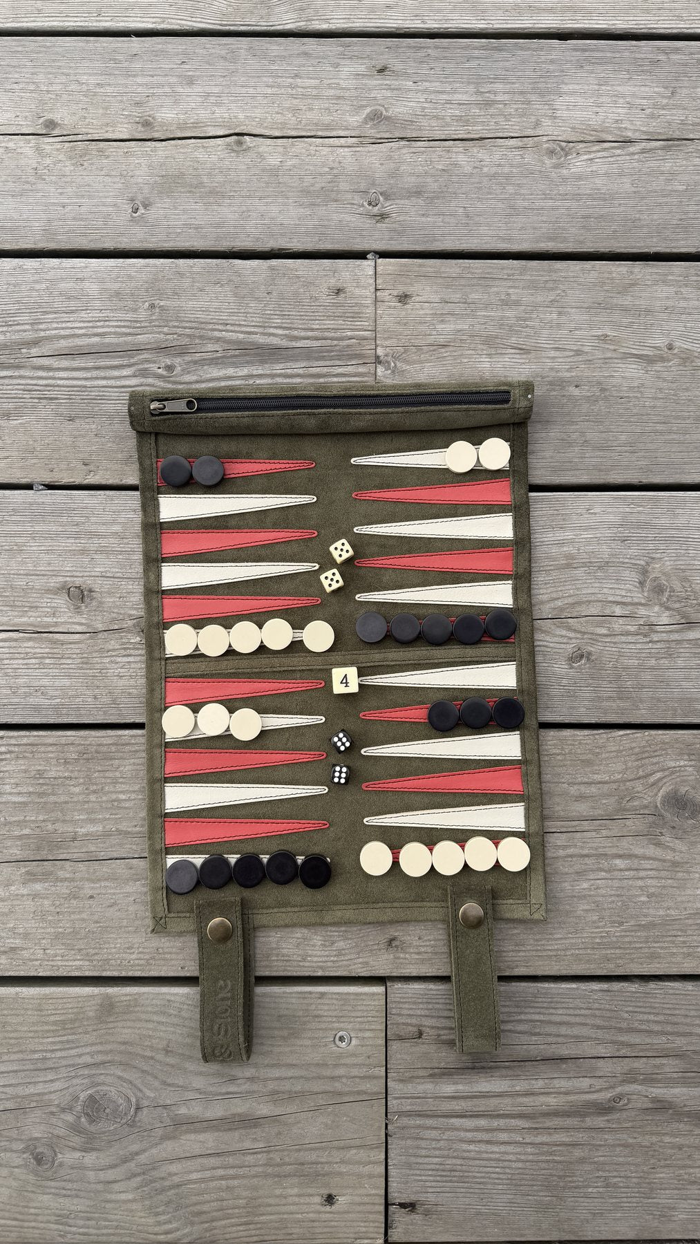 Olive Green suede backgammon set rolled for travel