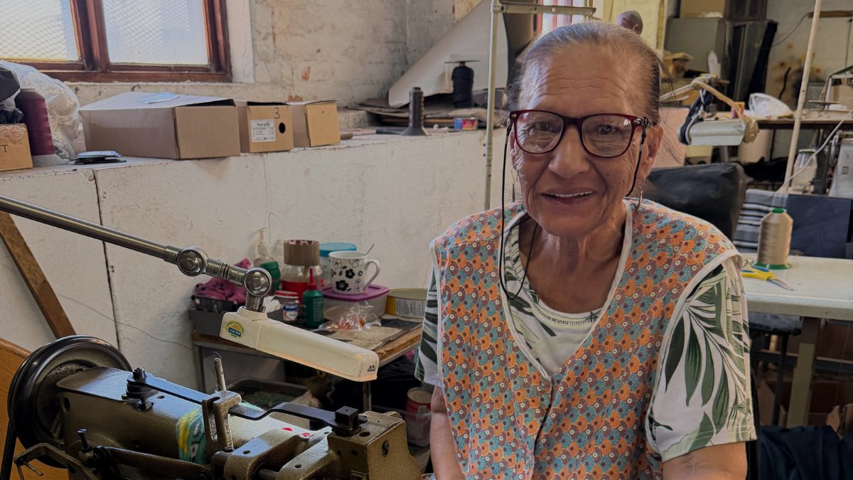 Ronnie sewing a Suede and Stone backgammon set in the workshop